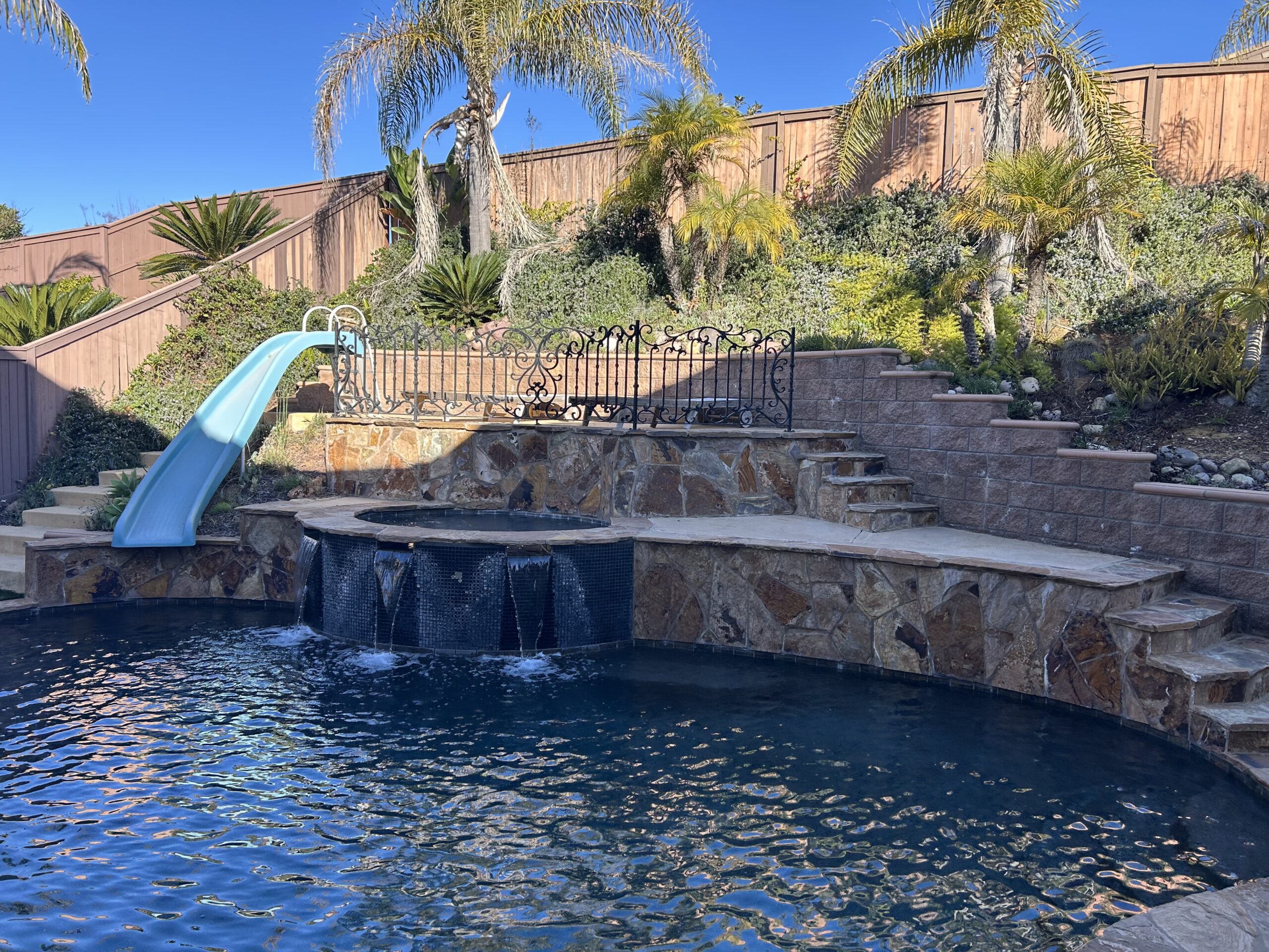 Technician performing Pool Maintenance in Middletown on a residential swimming pool