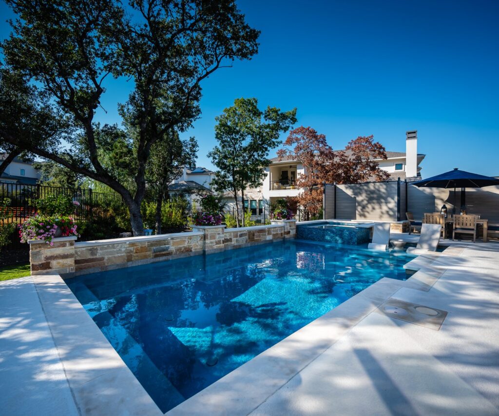 Custom pool design with modern backyard features